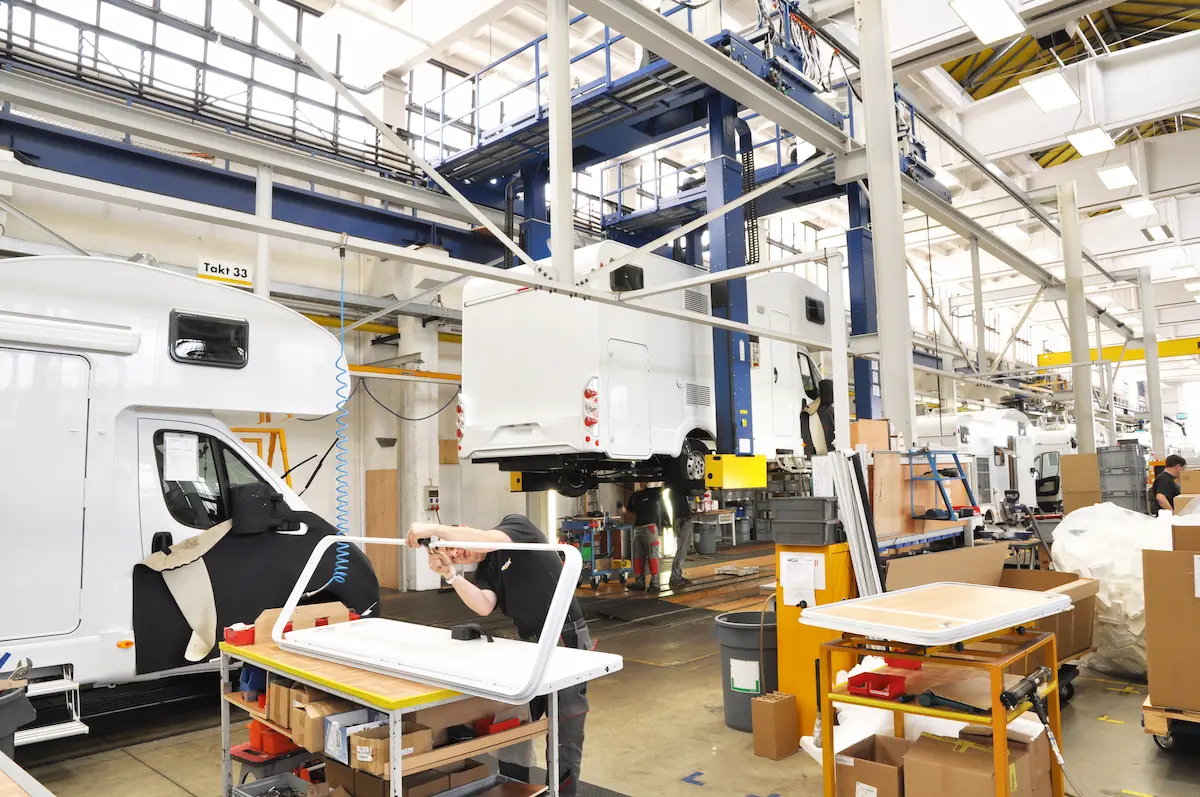Motorhome shells being assembled in a manufacturing plant