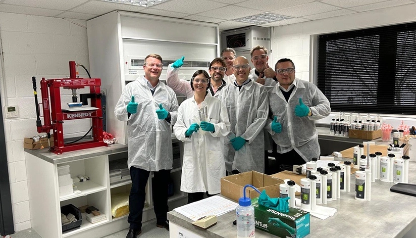 Team of technicians in lab coats in the SCIGRIP testing laboratory