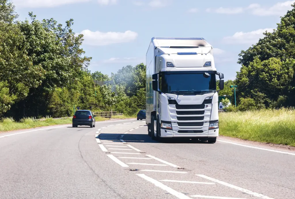 White articulated lorry on a country road